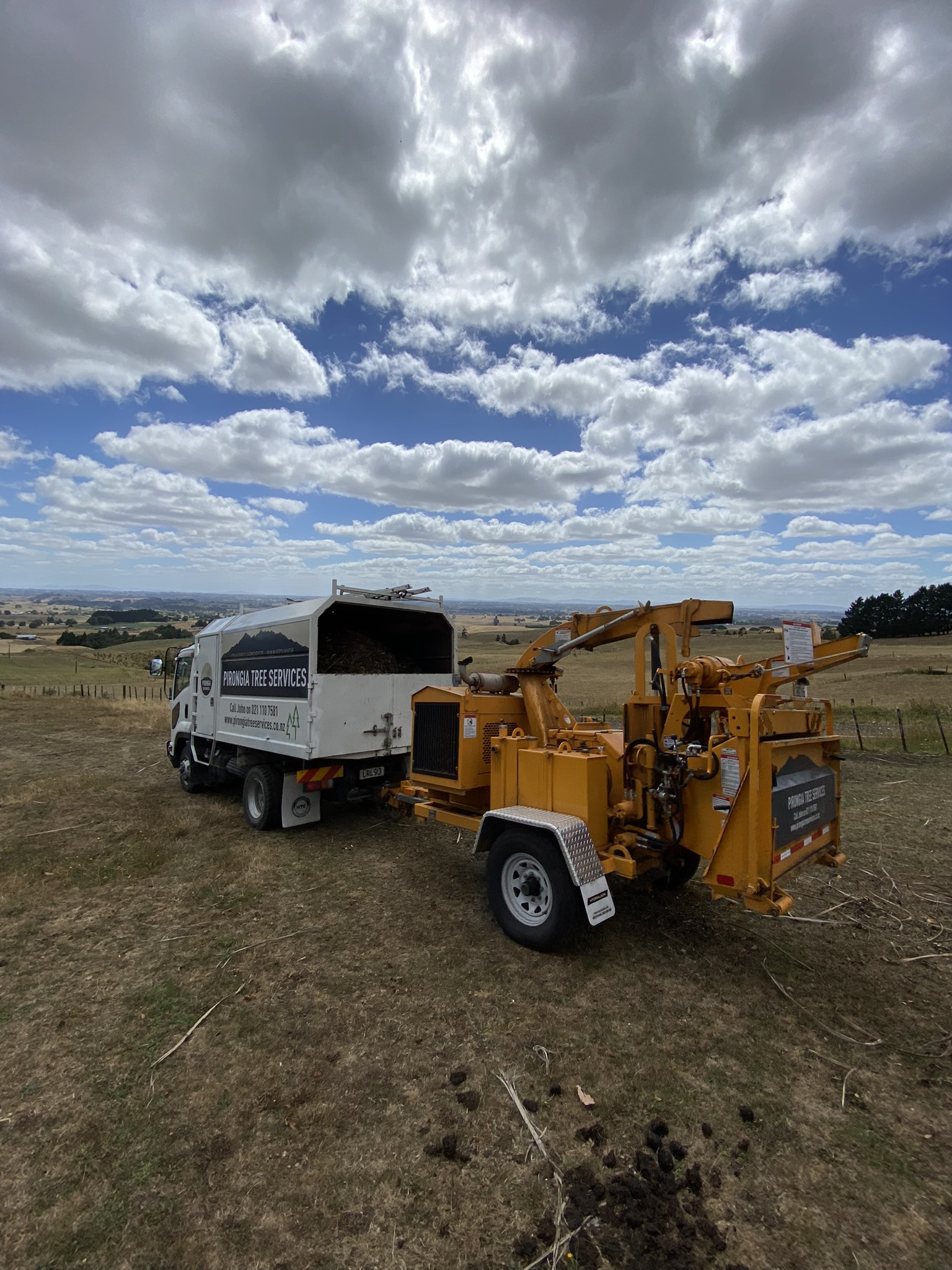 Truck And chipper on site.